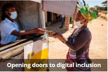 Zambia. Mulumbwa at the mobile money kiosk withdrawing WFP cash assistance 