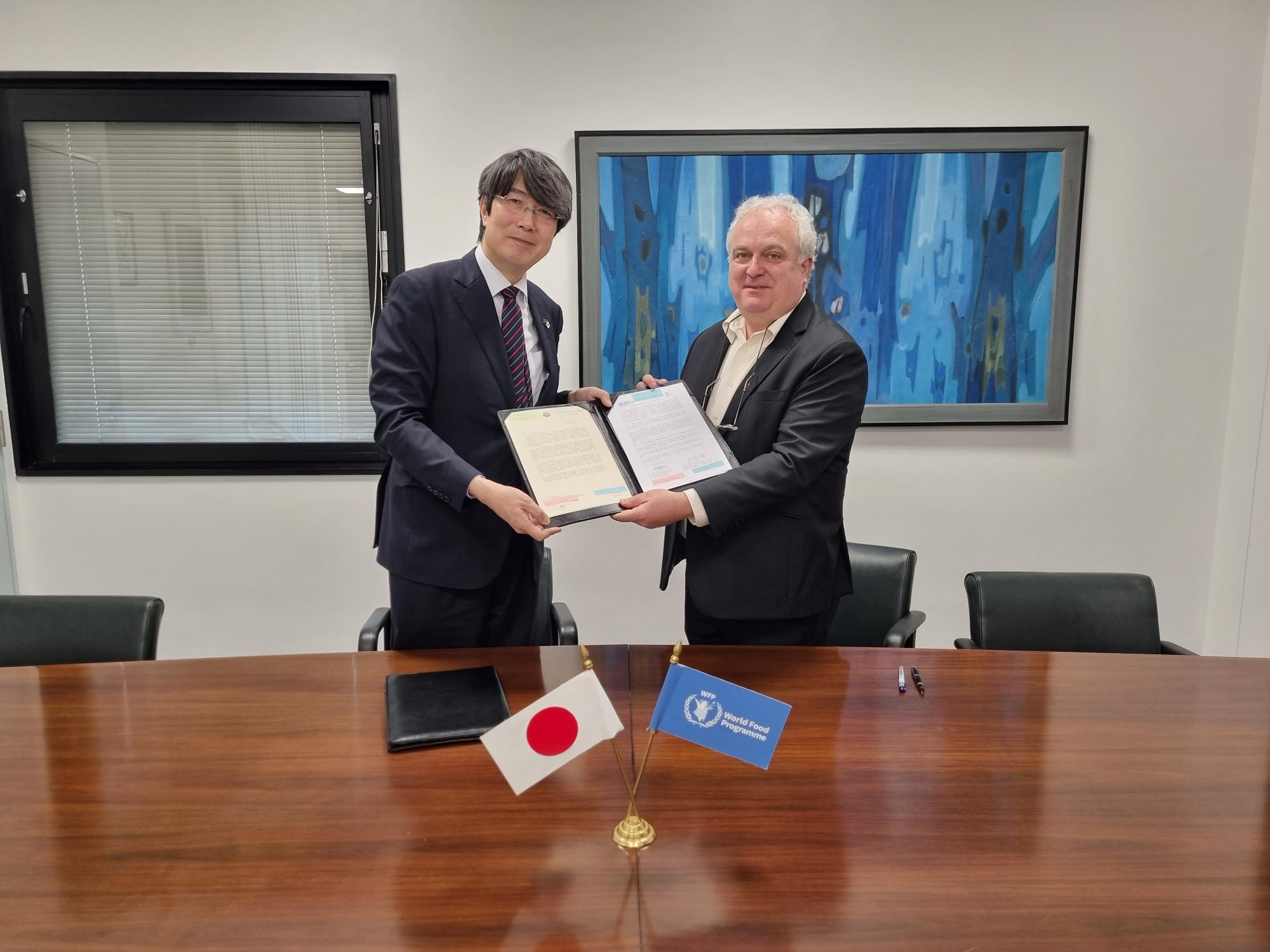 Photo: WFP/ Photogallery; signing ceremony between the Ambassador of Japan to Bangladesh, Mr. Kiminori Iwama , and Dom Scalpelli, WFP Resident Representative and Country Director.