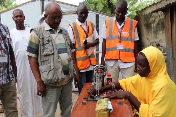 A young tailor practising her craft in Kiribiri Borno State in a livelihood project.