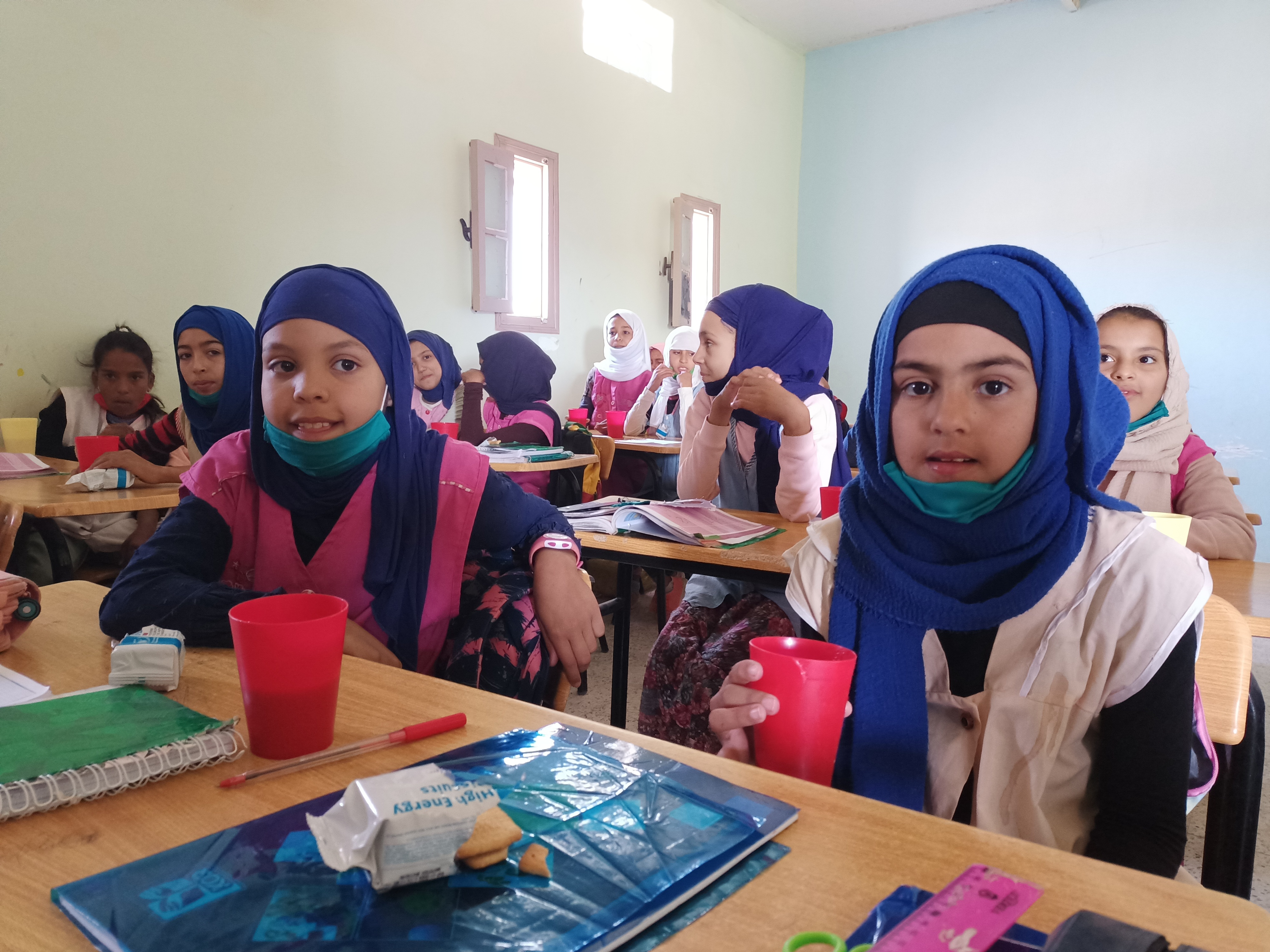 Sahrawi refugee girls in a classroom enjoying their morning snacks. Photo: WFP/Abderezak Bouhaceine 