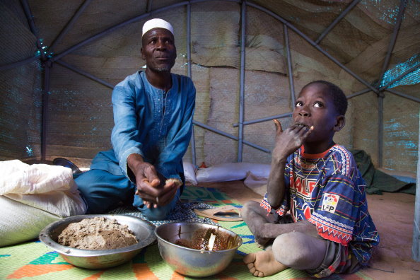 Photo: WFP/ Marwa Awad, A family eating their meal in Burkina Faso