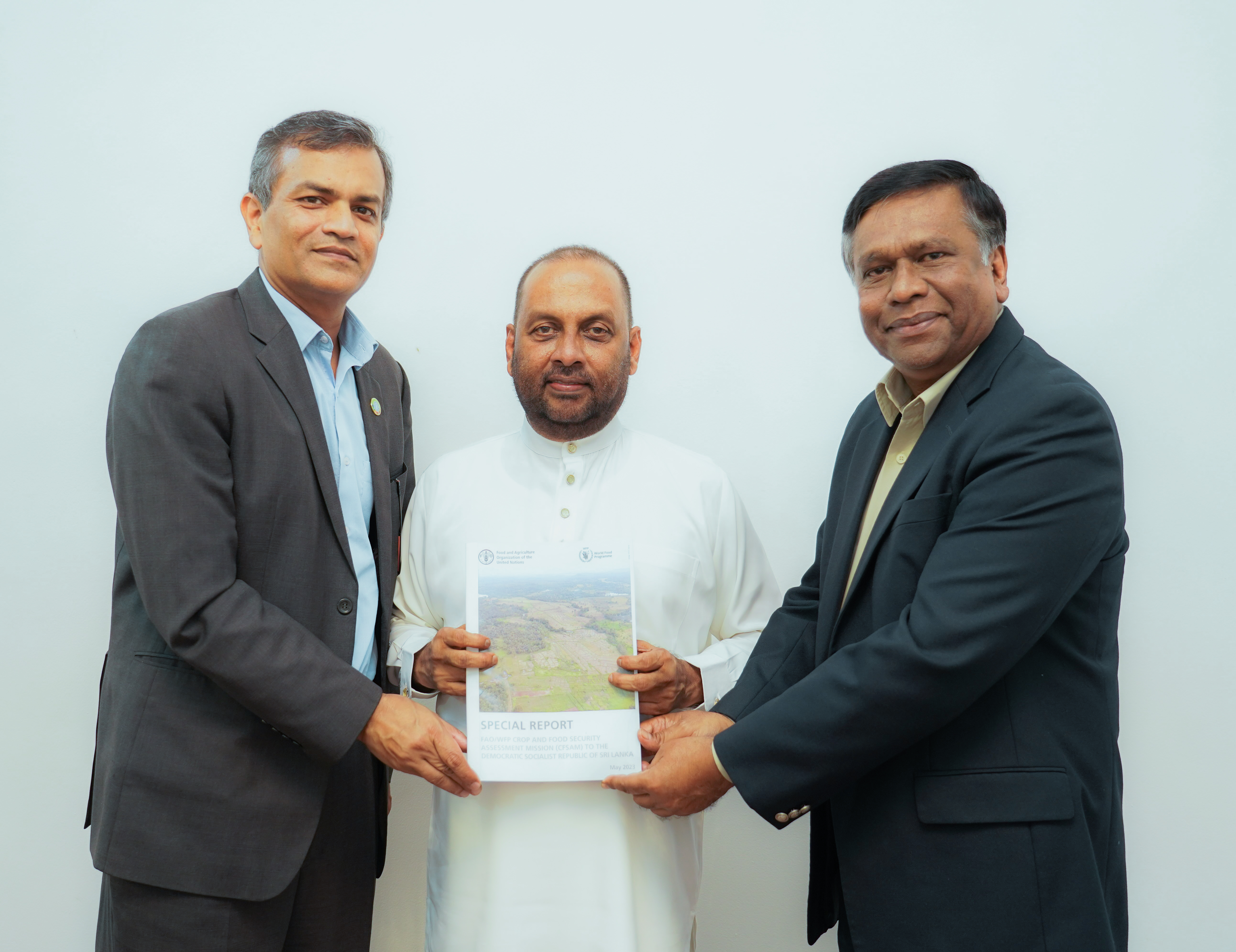 Photo: WFP/ Photogallery. The second joint FAO-WFP Crop and Food Security Assessment Mission (CFSAM) report on Sri Lanka was handed over to the Minister of Agriculture, Mahinda Amaraweera, by FAO Representative for Sri Lanka and the Maldives, Vimlendra Sharan and WFP Sri Lanka Representative and Country Director, Abdur Rahim Siddiqui.