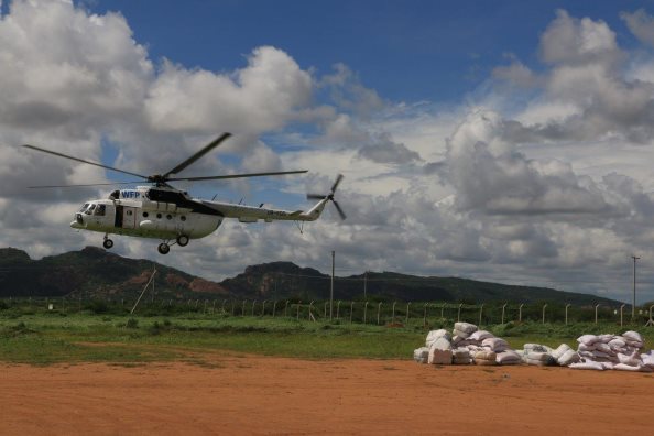 Photo: WFP/ Martin Karimi, WFP is assisting Kenyan Government airlift food and non-food items to villages cut off by flooding in Wajir, Mandera, Garissa, and Tana River counties