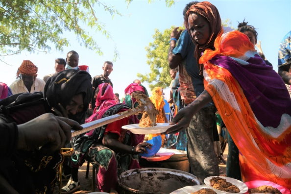 Photo: WFP/Leni Kinzli, Ethiopians fleeing intense fighting in their homeland of Tigray, gather in the neighbouring Sudanese Um Rakuba Refugee Camp, Gedaref State.
