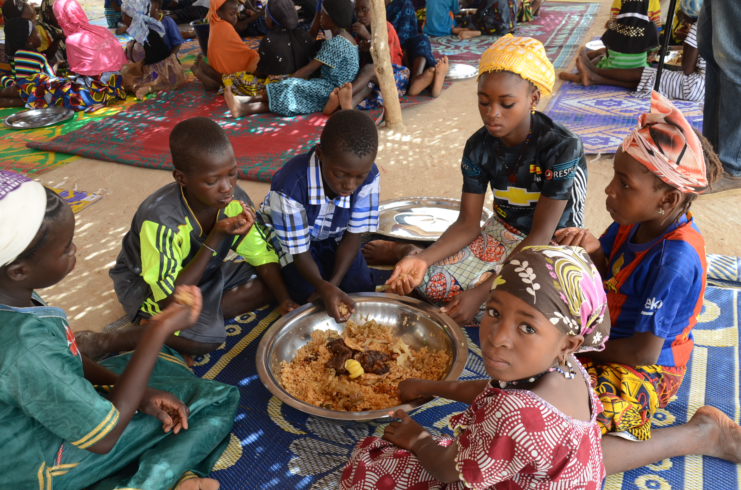 people eating together in Mali