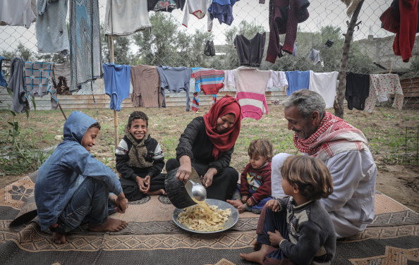 Photo: WFP/Ali Jadallah, Family from Beit Hanoun in the North Gaza governorate gathering with their children over an Iftar meal. Amidst heightened hardships in the Gaza Strip, WFP electronic voucher assistance helps most vulnerable families purchase diverse and healthy food from local shops