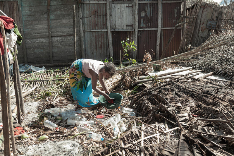 Photo: WFP/Photogallery. Woman in her neighbourhood damaged by cyclone Batsirai, Madagascar.