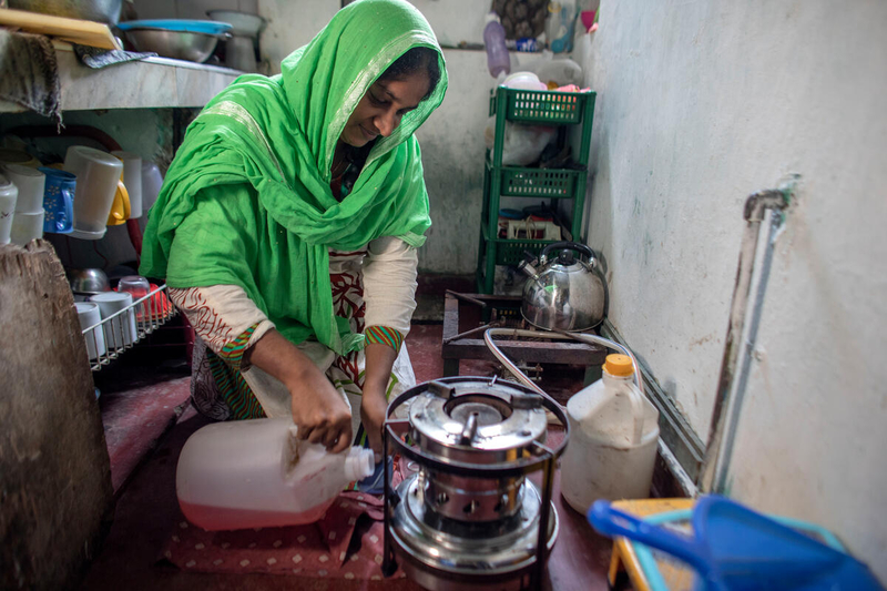 Photo: WFP/Josh Estey. Sri Lanka, a women has been forced to use kerosene to cook with as gas canisters are extremely hard to ascertain. All forms of petrol products are in limited supply through out Sri Lanka, forcing most families to find alternative methods of cooking