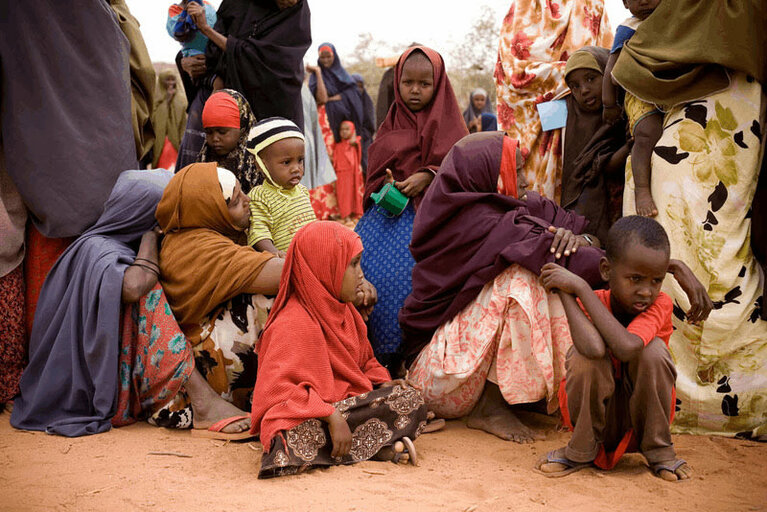 Women and children wait for assistance from the drought in Dolo, southern Somalia.