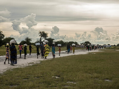 people are walking on a road