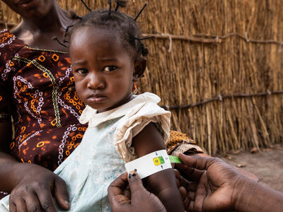 Mantapala refugee settlement, Nchelenge district, Zambia. Mukata Santé's daughter gets screened for malnutrition.