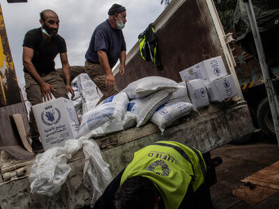 People are unloading a truck 