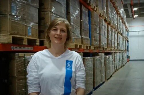 a woman in a warehouse