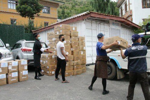 people are carrying a boxes