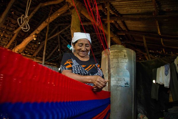 a woman is knitting