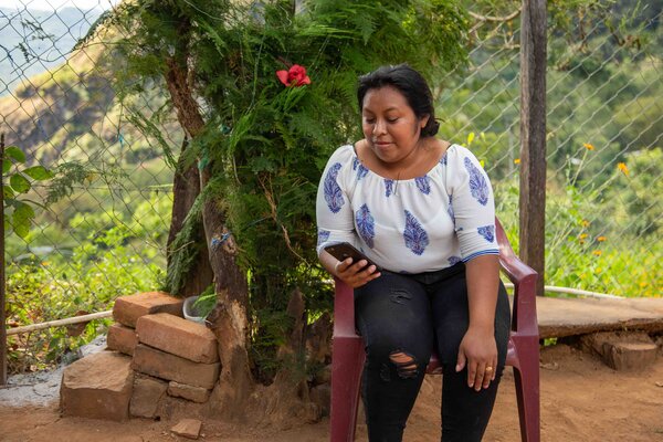 a woman is checking her mobile