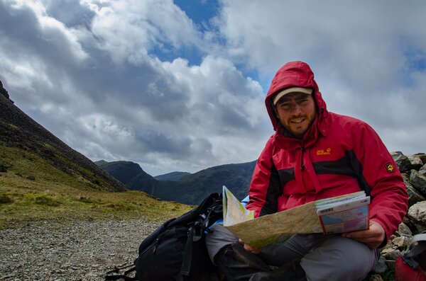 Man reading map outdoors