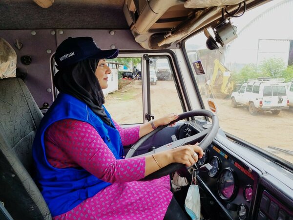 Woman driving WFP truck