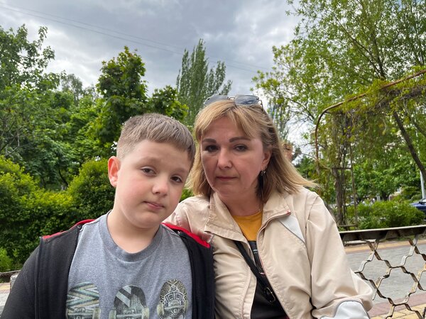 Oksana Potaenko, a 46-year-old mother from Mariupol, and her son Oleksiy, internally displaced in Ukraine, 9 received WFP cash assistance.