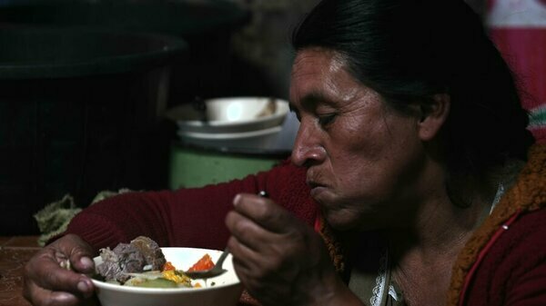 a woman is having her meal