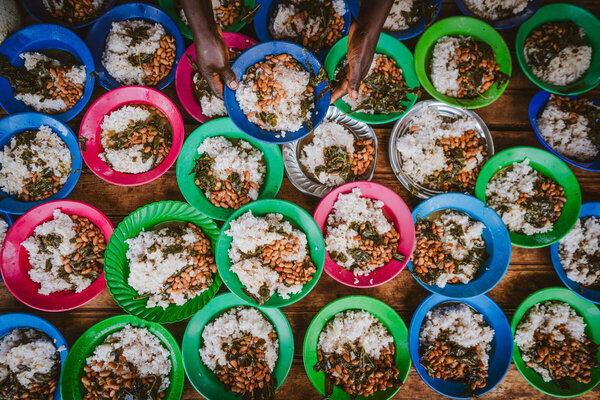 Plates of nutritious meals provided daily by WFP for the students at Bwica Primary School, Burundi. WFP/Arete/Fredrik Lerneryd