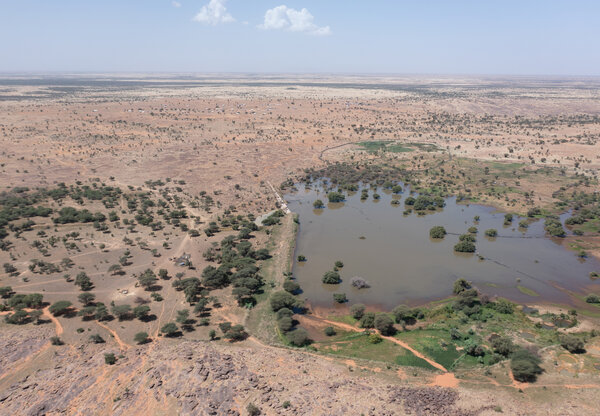 The same aerial view showing a 'lake' of seasonal rainwaters captured by a dike. Photo: WFP/enHaut!