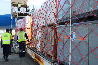 UNHRD staff organize a shipment of food to Mozambique in February 2026.