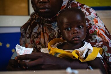 Close-up shot for Duha the 8-month-old girl who is under treatment program for Severe Acute Malnutrition (SAM) after receiving her monthly ration of RUTF supplements in WFP-Supported nutrition centre Ahmed Gasim in Portsudan.
