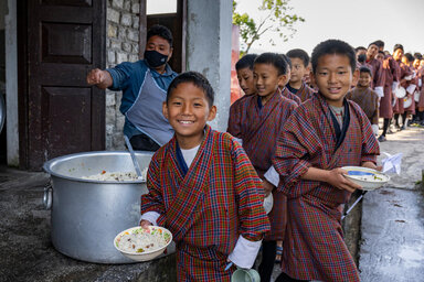 Students receive their breakfast in school in Zhemgang, Bhutan.