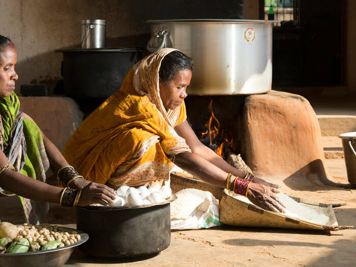Two Indian women preparing food