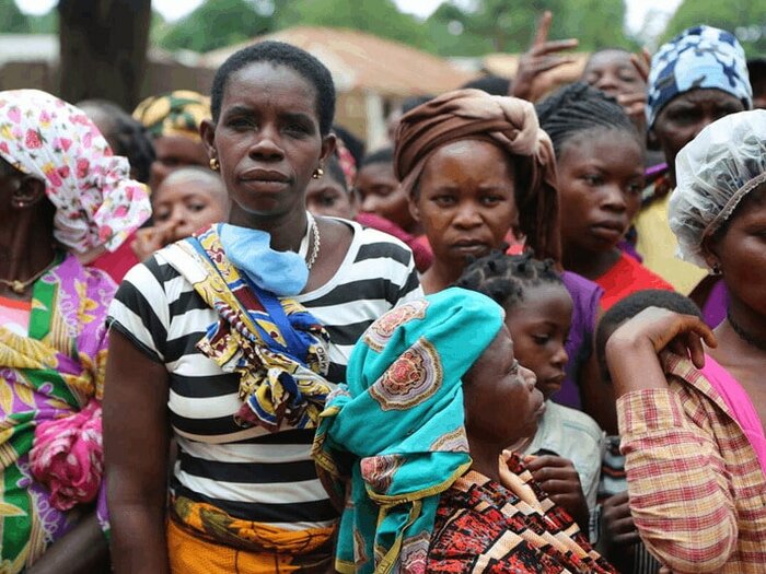 Women gathered for a general food distribution to displaced people from Palma in Mueda in Mozambique