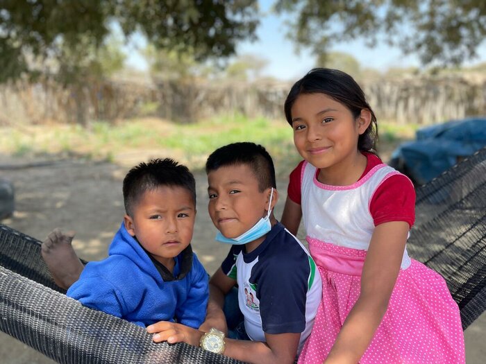 Portrait of 3 children living in Sechura Desert with their parents where they have a farm.