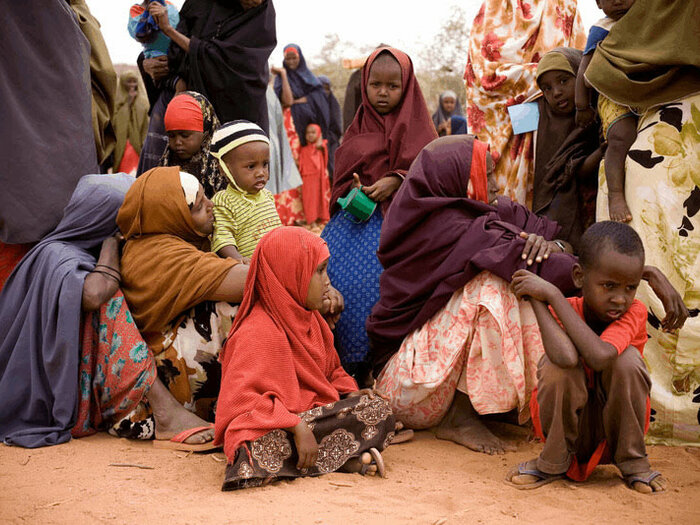 Women and children wait for assistance from the drought in Dolo, southern Somalia.