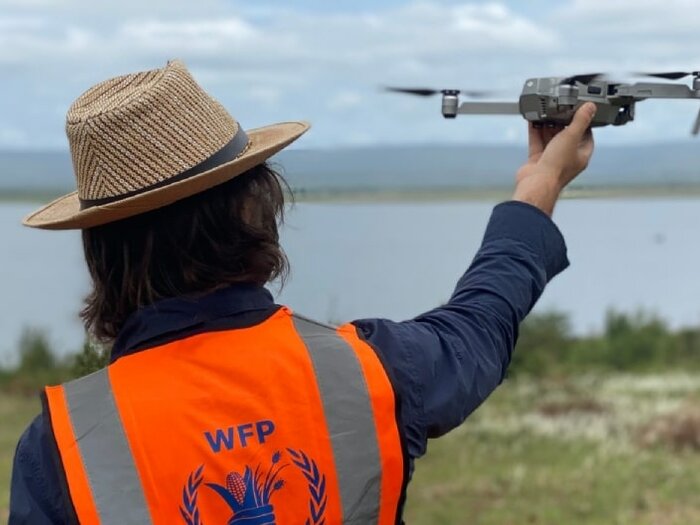 WFP staff holding a drone