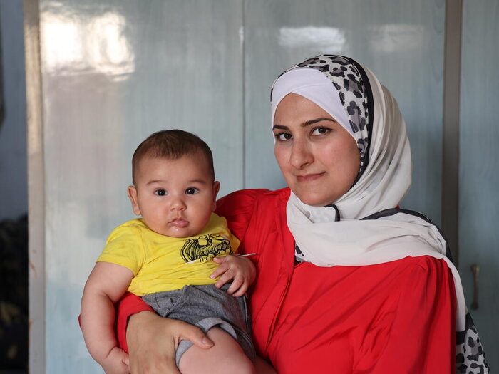 Salwa Qarboun 32 years old with her baby Mohammed 3.5 months.