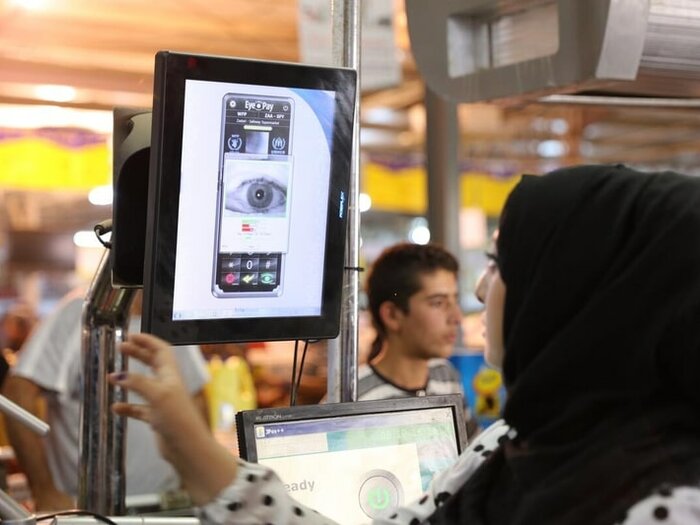 Syrian refugee pays for groceries using a scan of her iris. WFP introduces Iris Scan Technology to provide food assistance to Syrian refugees in Zaatari Refugee Camp.