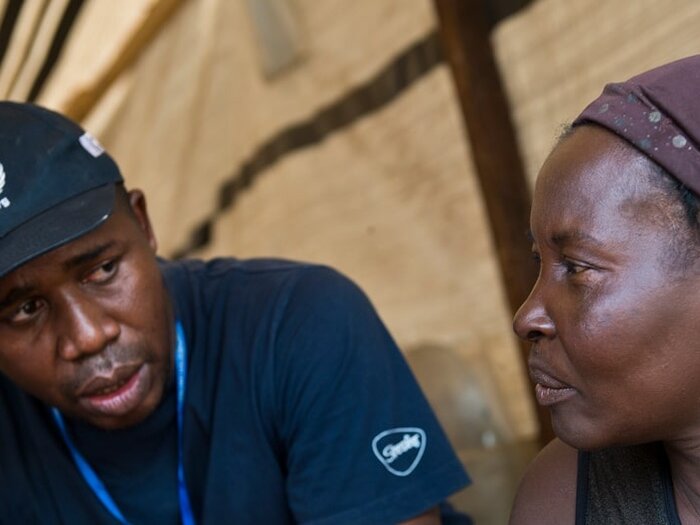 WFP staff interviewing a woman