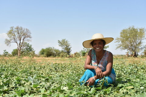 Woman in field in Madagascar