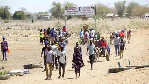 On the run: tens of thousands of people flee conflict-hit Sudan 