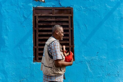 Rescued orphan with WFP staffer