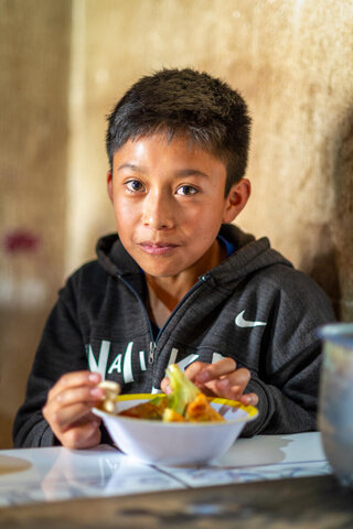 Derick (12) eats a healthy and nutritious lunch prepared by his mother Mirna at home in the municipality of Patzún, Chimaltenango, Guatemala. Photo: WFP/ Giulio d’Adamo
