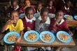 Schoolchildren enjoy a lunch made with salvaged pulses in Kenya. Photo: WFP/<a href='https://insight.wfp.org/ugly-vegetables-destined-for-the-dump-are-now-helping-to-feed-thousands-of-schoolchildren-in-kenya-68c8c920aa70' data-medium-id='68c8c920aa70'>Martin Karimi</a>
