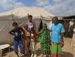 Fathia's family outside the tent that they now call home. Photo: WFP/Datto Gaas