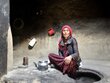 Woman sat on floor in house