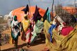 New arrivals build makeshift shelters on the outskirts of Kenya's Dadaab refugee camp. Tens of thousands of Somalis have arrived here in recent months, fleeing drought in their homeland. Photo: WFP/Martin Karimi 