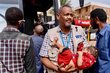 WFP Sudan Monitoring Assistant Ammar Elsheikh carries orphan. OCHA/Ala Kheir