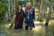 A WFP employee and Bangladeshi woman hit by floods. Photo: WFP/Mumit M/
