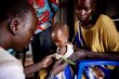 Nyanene Gatdoor holds her son Tuach as he's tested for malnutrition in South Sudan's Unity State. Photo: WFP/Samantha Reinders