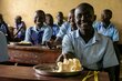Photo credit: WFP/Eulalia Berlanga. A student eating lunch at St. Mary Magdelene Nursery and Primary School in Kapoeta, Eastern Equatoria state. 