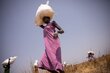 WFP: photo/ Samantha Reinders. Women collect bags of food after an air drop in Uror county in South Sudan where families have been experiencing emergency levels of hunger 